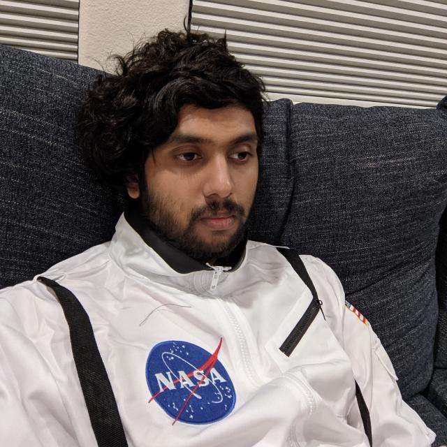 Portrait of Rahul Poundarik wearing a NASA jacket